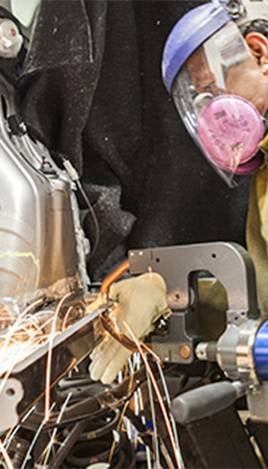 Welding and repairing car chassis metal